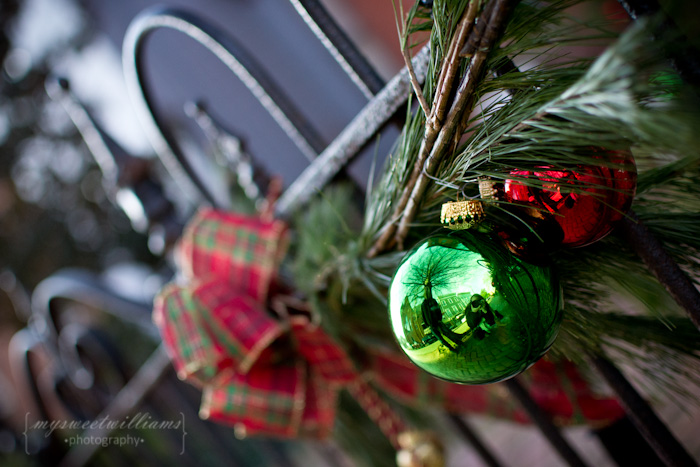Christmas bulbs on fence